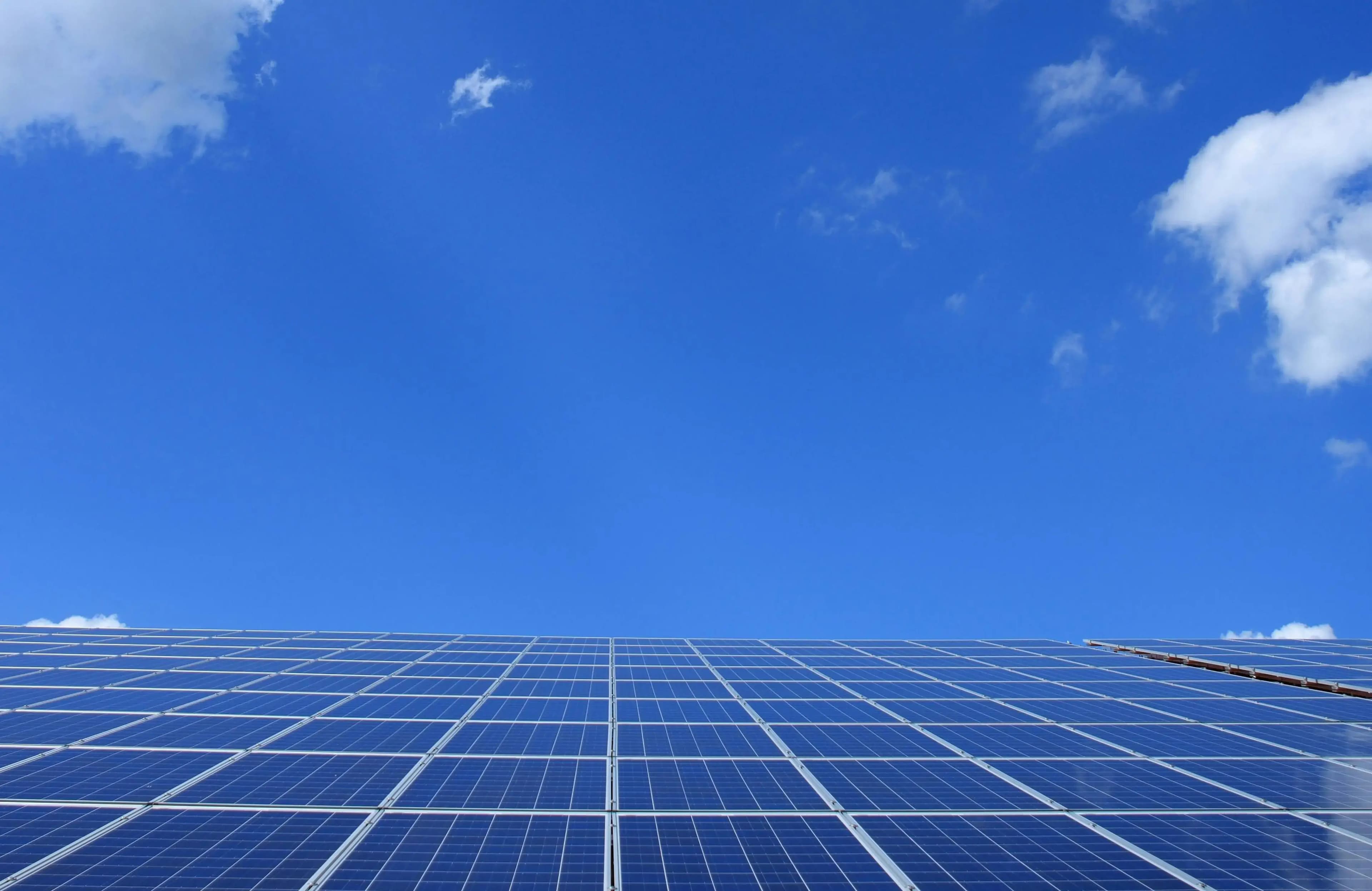 Solar panels mounted on roof showing the sky